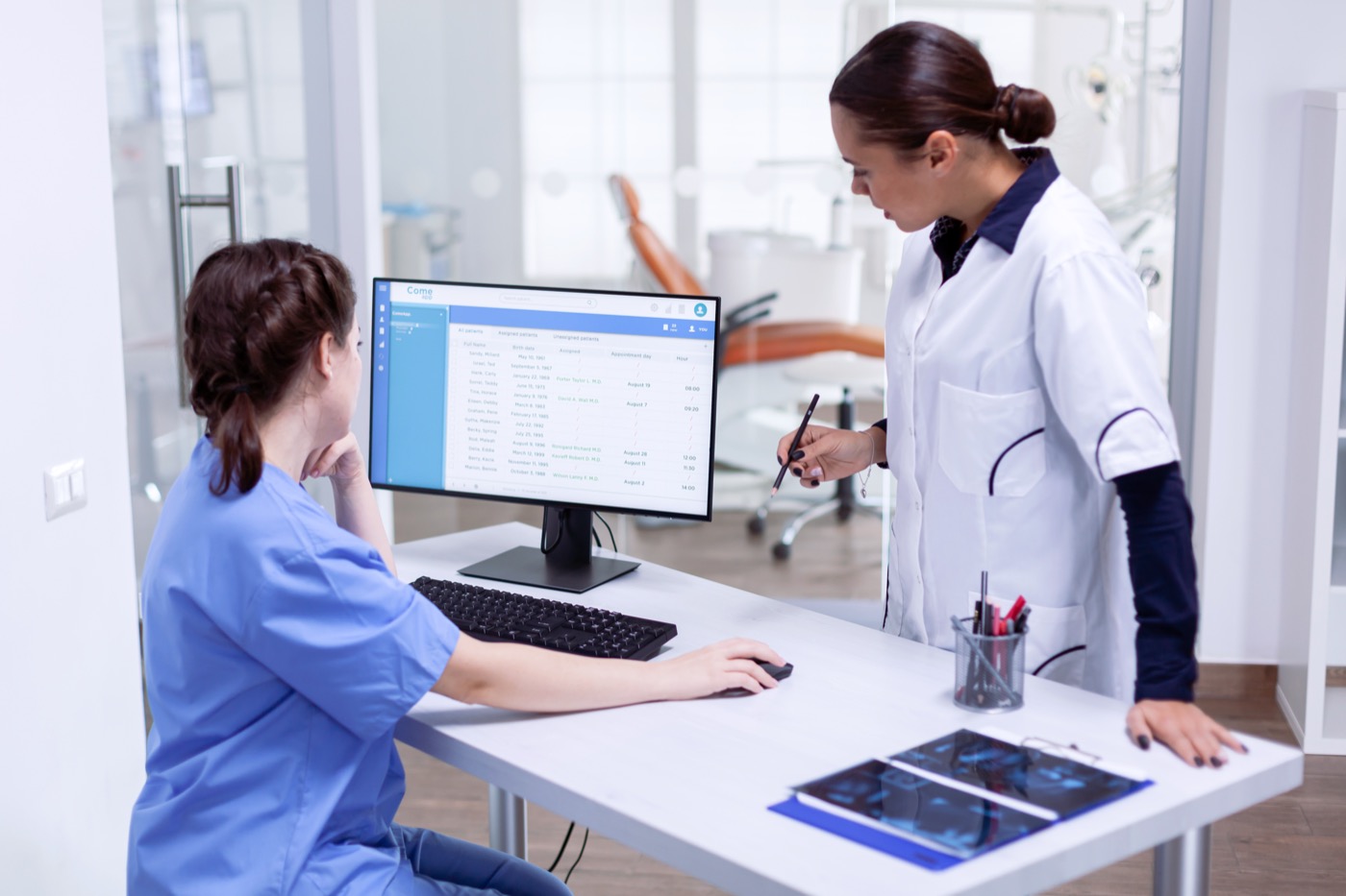 Ugandan healthcare professional with digital medical imaging equipment